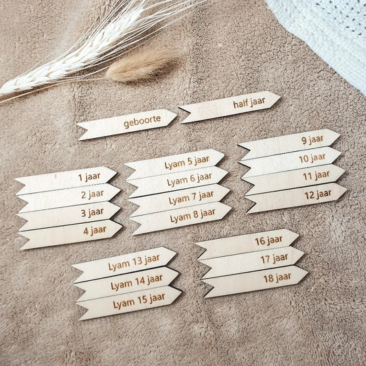 Gepersonaliseerde groeipijltjes voor houten groeimeters in een set van 20 stuks.